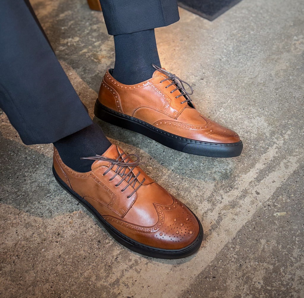 Man wearing brown cognac leather wingtip dress sneakers made in italy