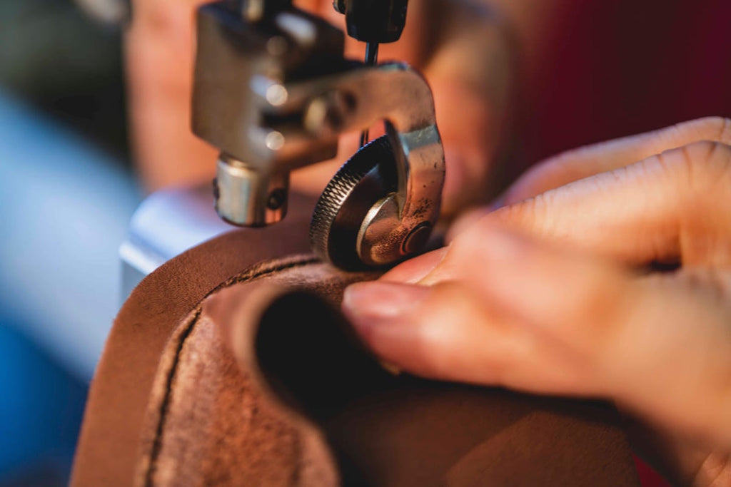 Artisan sewing leather for shoe