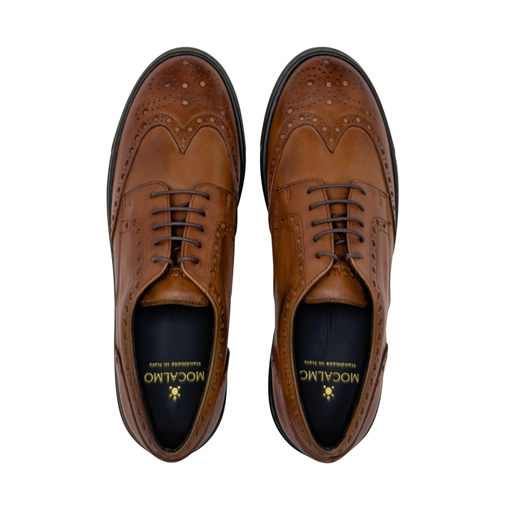 Women's cognac leather brogue wingtip dress sneaker - top view
