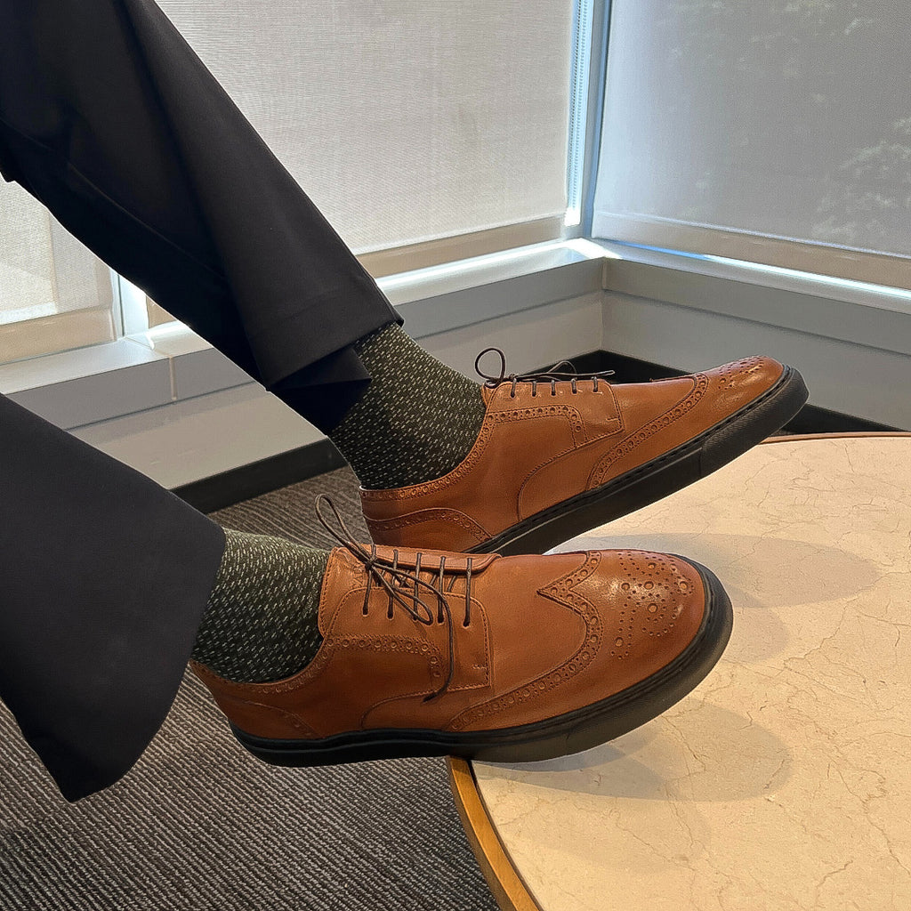 Man wearing Italian cognac leather wingtip brogue dress sneakers for work