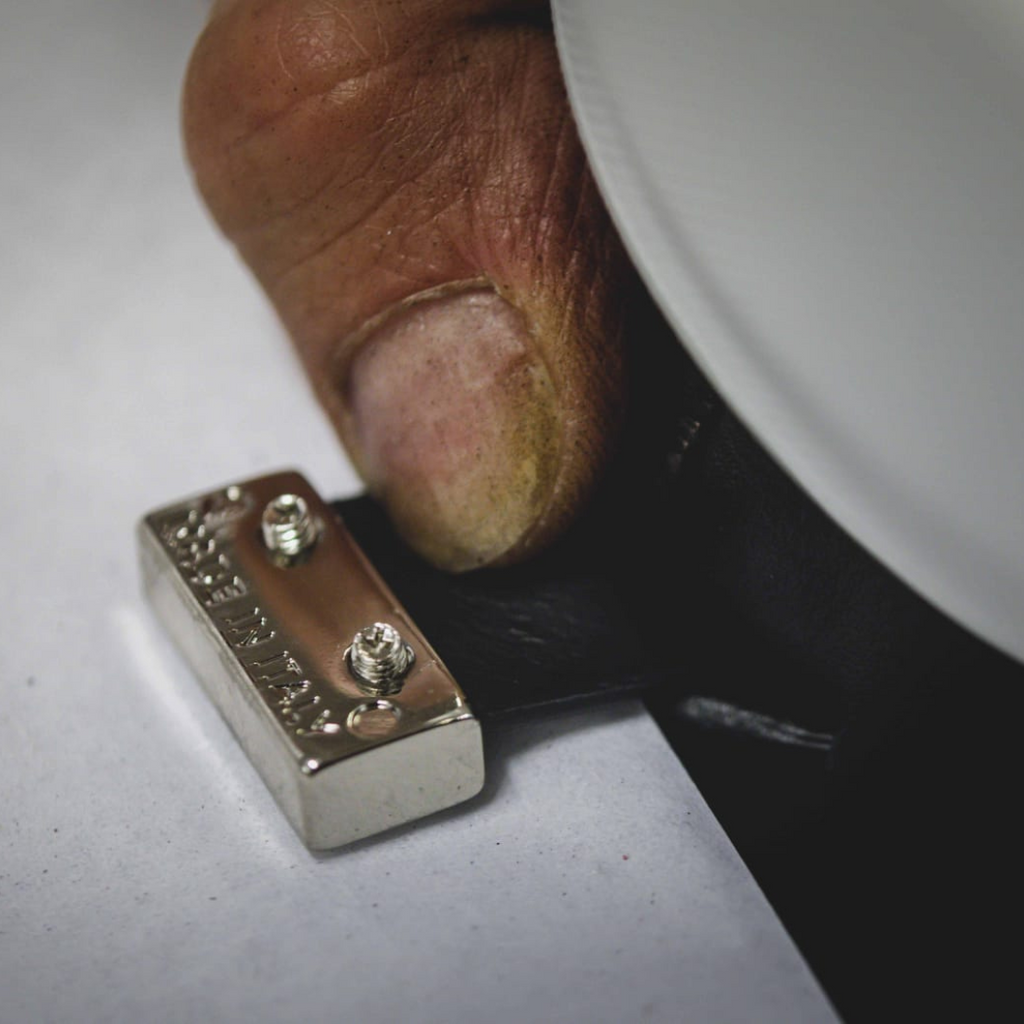 Artisan in Italy making black stylish leather sneakers